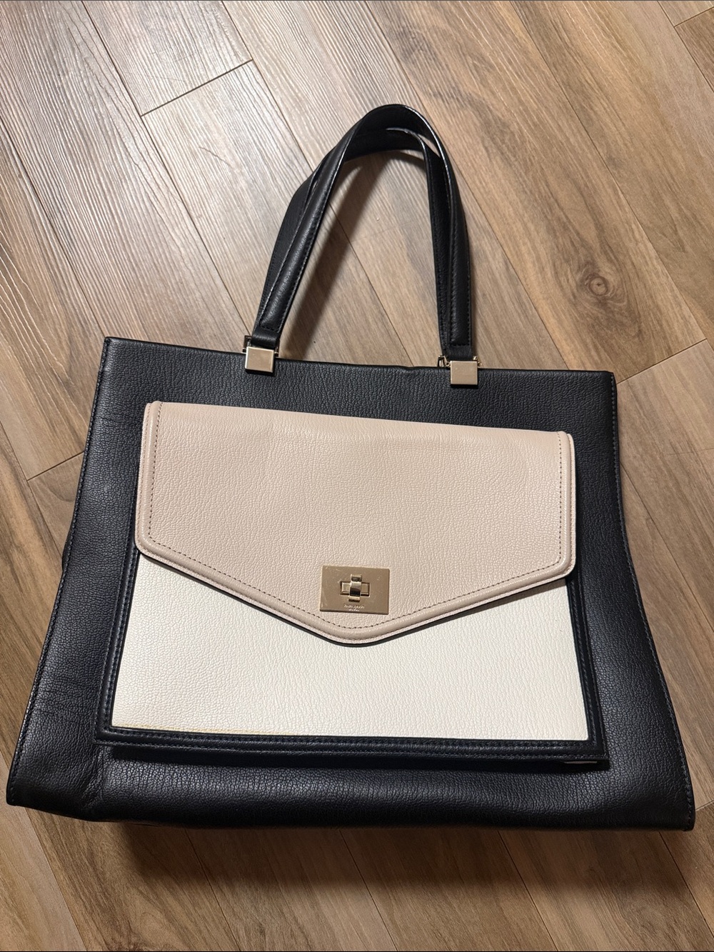 Kate Spade A gently used Structured Black Tote with Cream and Beige Front Pocket